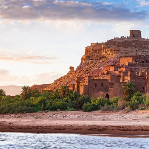 13901163-Fortified-village-of-Ait-Ben-Haddou-UNESCO-World-Heritage-Site-and-desert-oasis-at-sunset-Ouarzazate-province