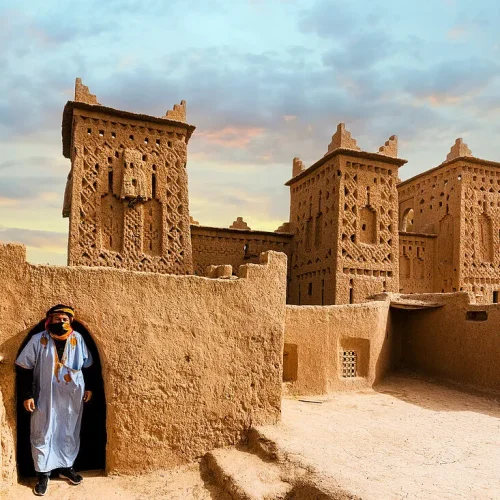 13928013-Berber-man-standing-at-the-historic-Kasbah-Amridil-Skoura-Atlas-mountains-Ouarzazate-province-Morocco-North