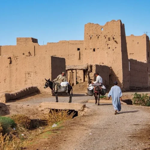 People arrive at the Kasbah of Rissani to buy a